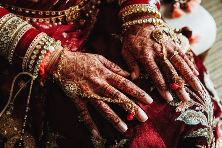 Exquisite mehendi-adorned hands showcasing the beauty of artistic body adornment.