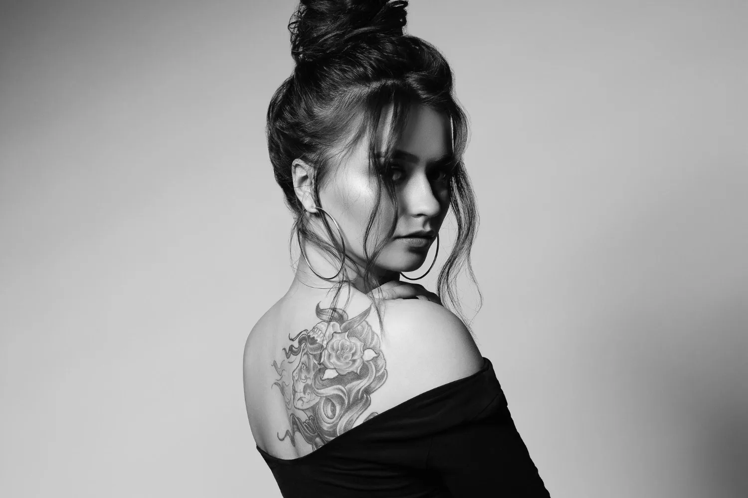 A Captivating Back Tattoo Showcasing Intricate Floral And Celestial Elements, Representing The Elegance And Individuality Of Women'S Self-Expression.