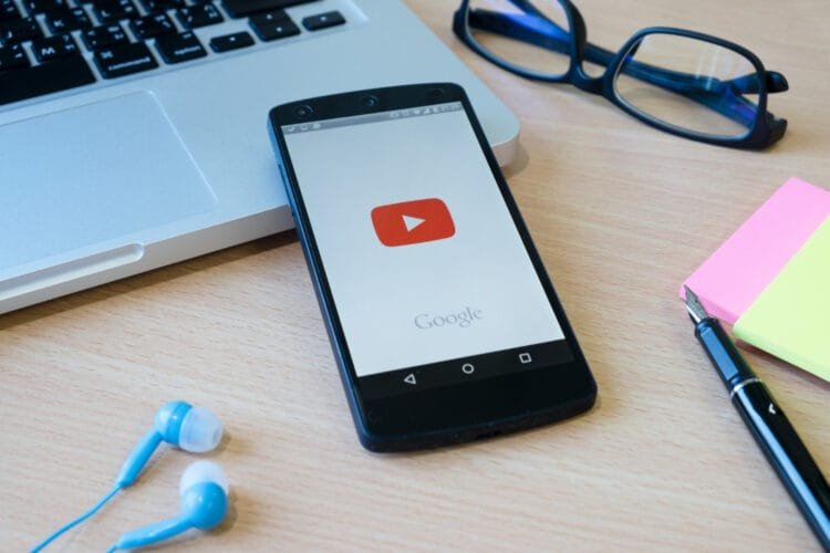 A laptop with a YouTube video playing, representing the contents and theme of the article.