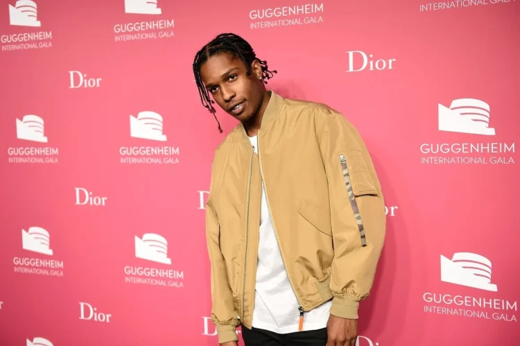 ASAP Rocky performing on stage in front of a cheering crowd.